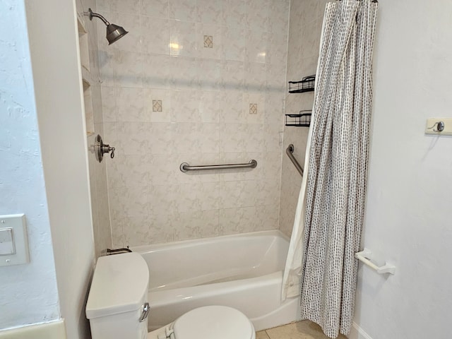 bathroom with tile patterned floors, shower / bath combo with shower curtain, and toilet