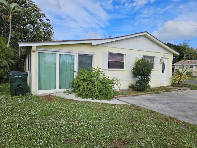 view of side of property with a yard