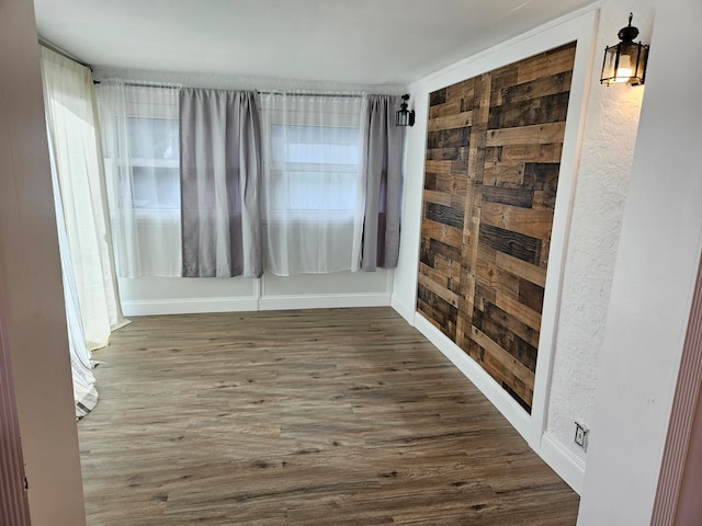 unfurnished room featuring dark hardwood / wood-style flooring