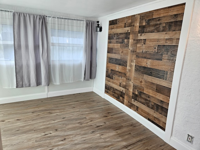 spare room with dark hardwood / wood-style flooring