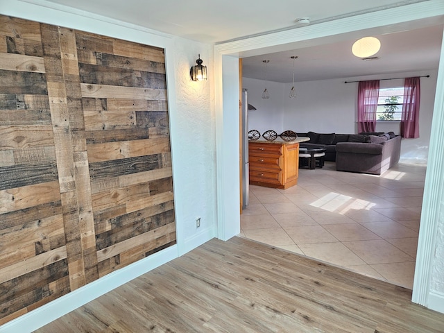 hallway with light tile patterned floors