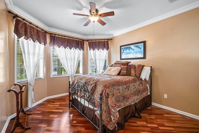 bedroom featuring a textured ceiling, ceiling fan, ornamental molding, and dark wood-type flooring