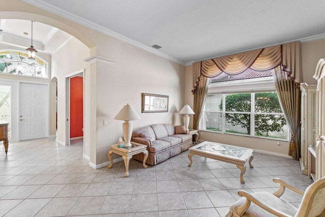 tiled living room featuring crown molding and a healthy amount of sunlight