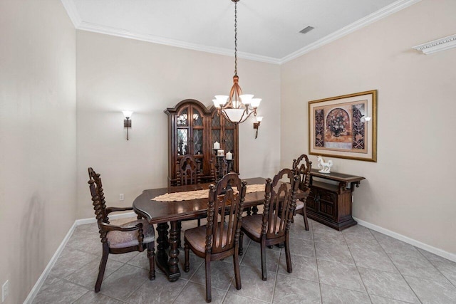 dining area with light tile patterned flooring, ornamental molding, and a notable chandelier