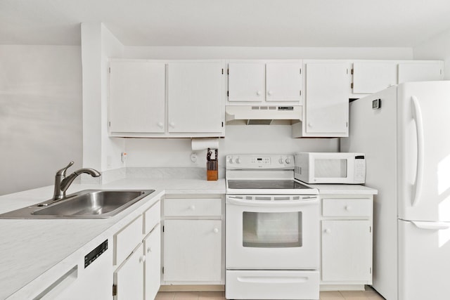 kitchen with a sink, light countertops, under cabinet range hood, white appliances, and light tile patterned flooring