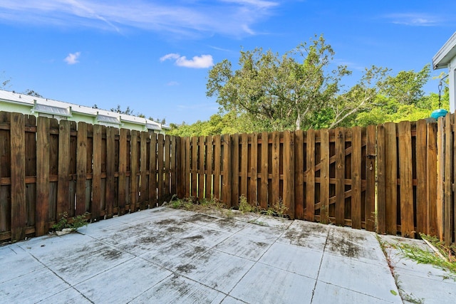 view of patio / terrace featuring fence