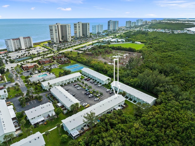 birds eye view of property with a water view