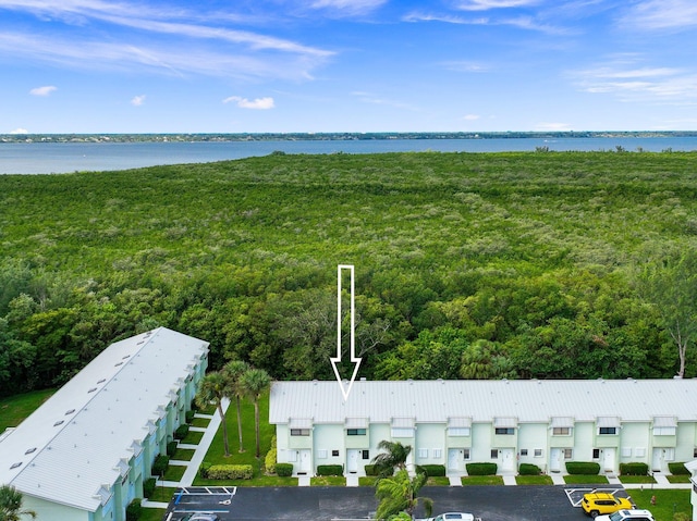 birds eye view of property with a water view