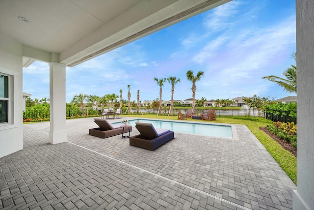 view of swimming pool featuring a patio