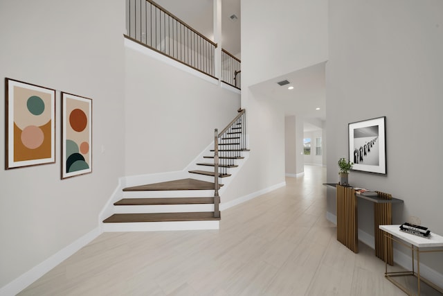 stairway with a towering ceiling