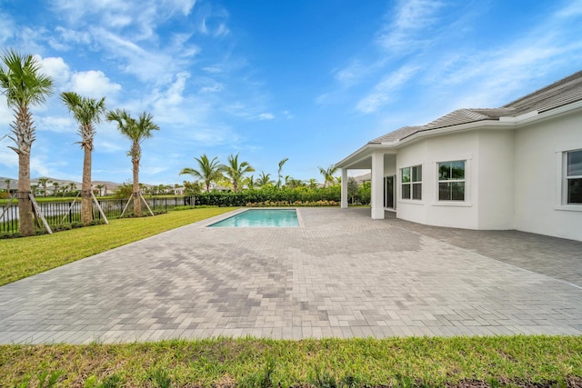 view of pool featuring a yard and a patio area