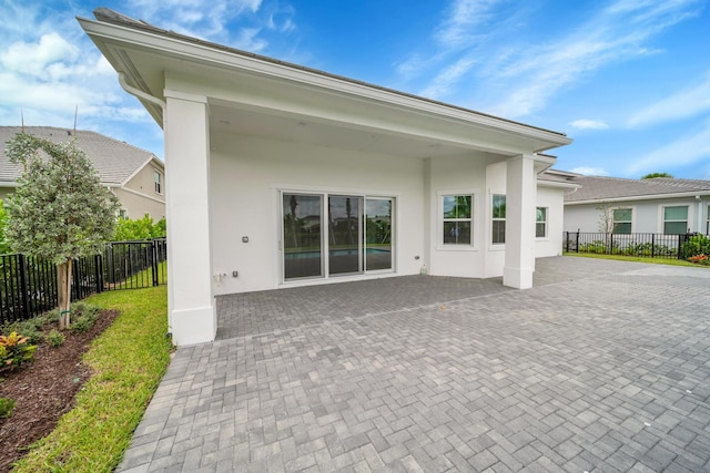 back of property featuring a patio