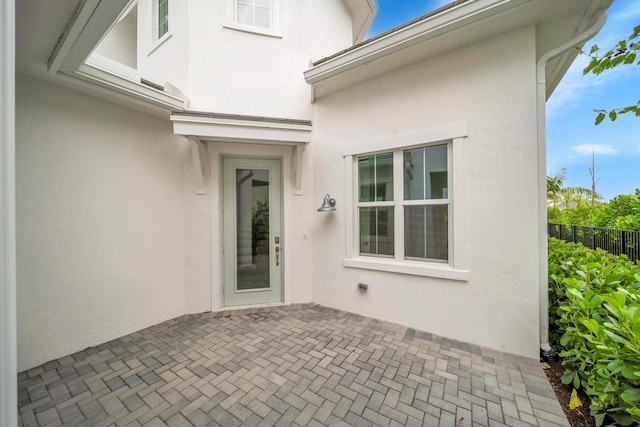 entrance to property with a patio