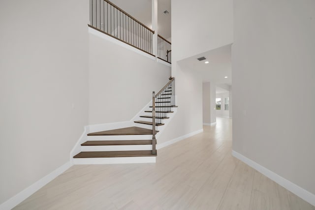 unfurnished bedroom featuring a closet and light carpet