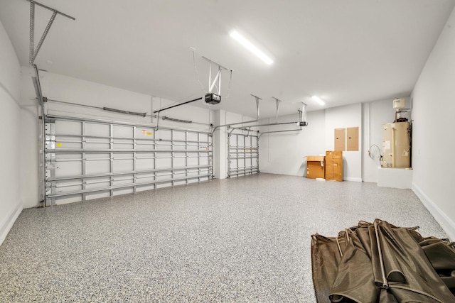 garage featuring a garage door opener and gas water heater