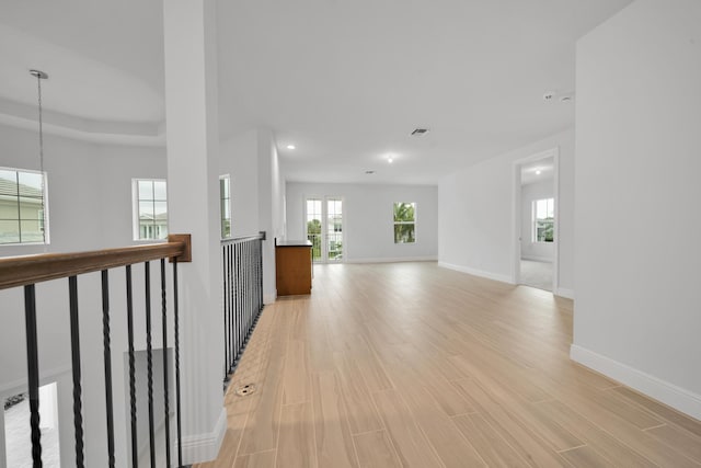 hall with light wood-type flooring