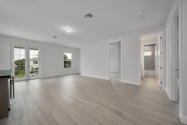 unfurnished living room with light hardwood / wood-style floors