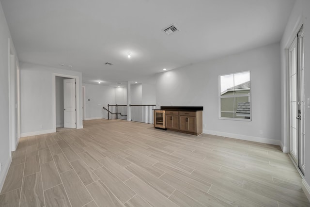 interior space featuring wine cooler and light hardwood / wood-style flooring