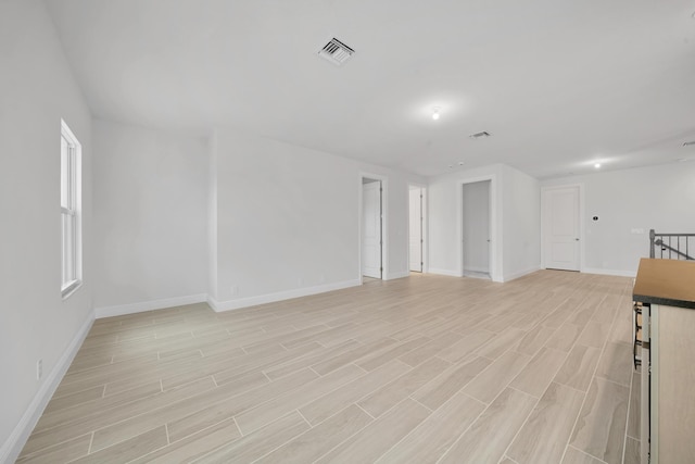 unfurnished living room with light hardwood / wood-style flooring