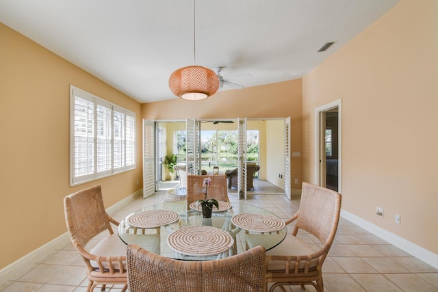 dining room featuring light tile patterned floors and ceiling fan