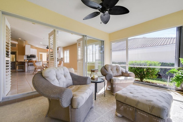 sunroom / solarium with ceiling fan