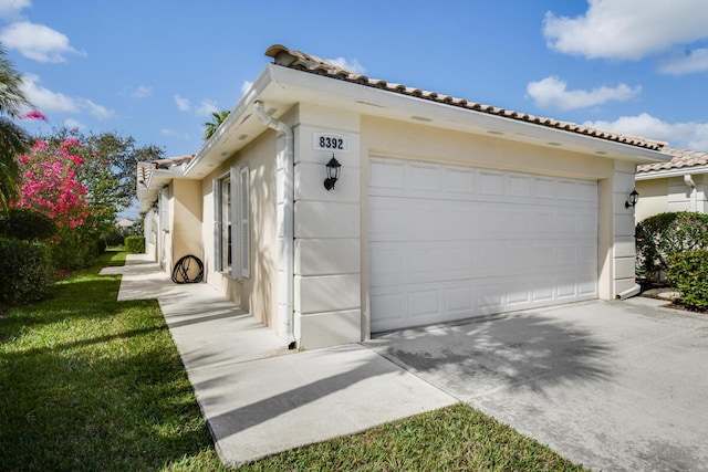 view of side of property with a garage