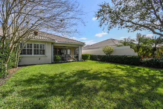 view of yard featuring a sunroom