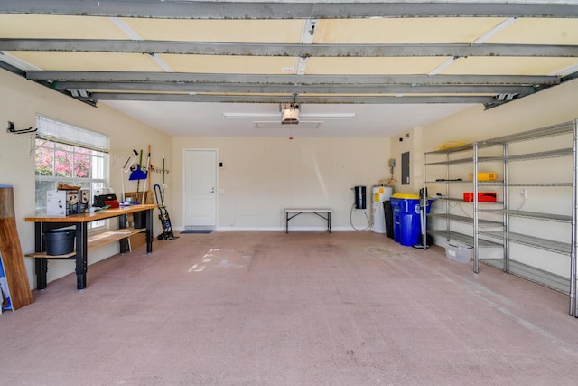 garage with a garage door opener and electric panel