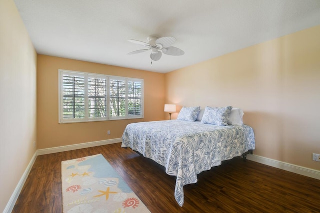 bedroom featuring ceiling fan and dark wood-type flooring