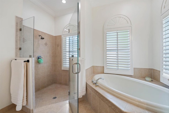 bathroom with independent shower and bath, ornamental molding, and tile patterned flooring