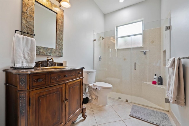 bathroom with vanity, tile patterned flooring, toilet, and an enclosed shower