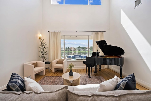 sitting room with wood-type flooring