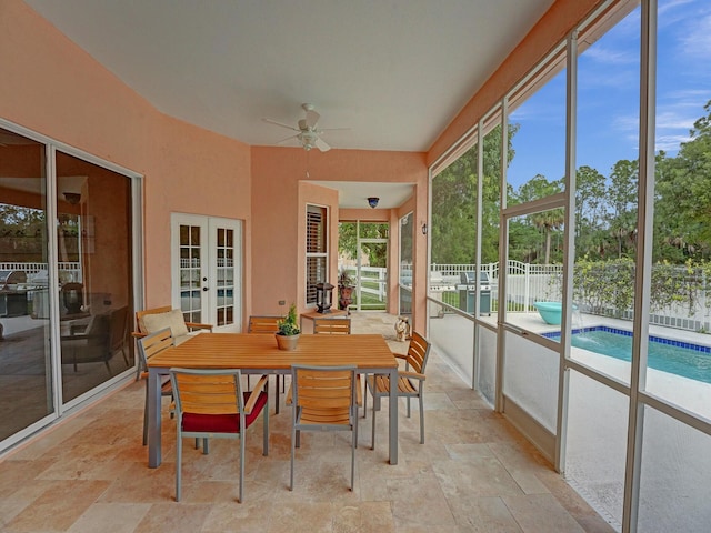 sunroom with french doors, ceiling fan, and plenty of natural light