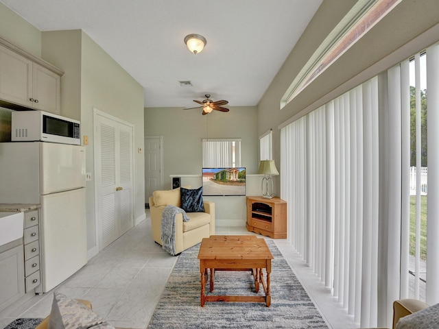 living room featuring ceiling fan