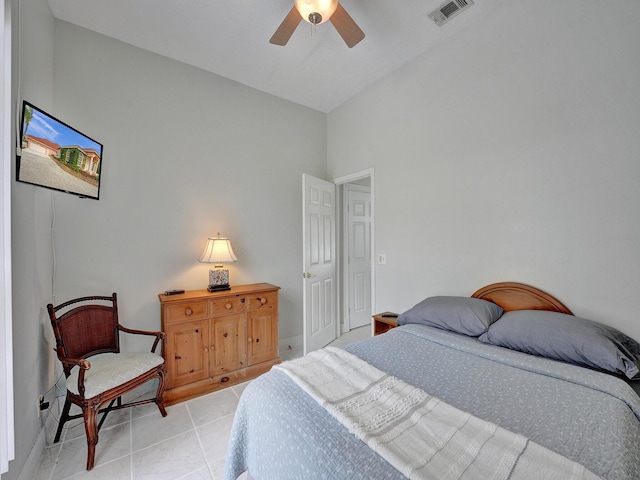 bedroom featuring light tile patterned floors and ceiling fan