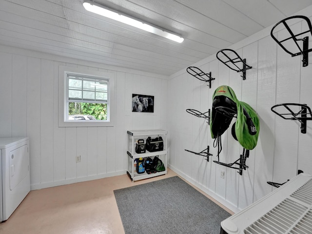 interior space with concrete flooring and washer / dryer