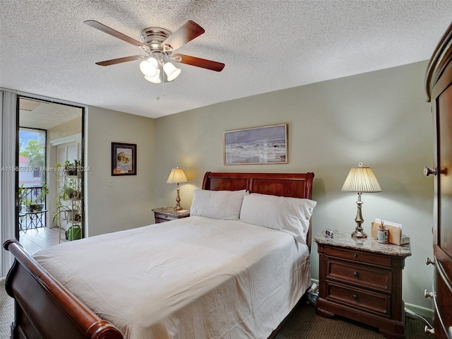 bedroom featuring a textured ceiling, carpet floors, and ceiling fan