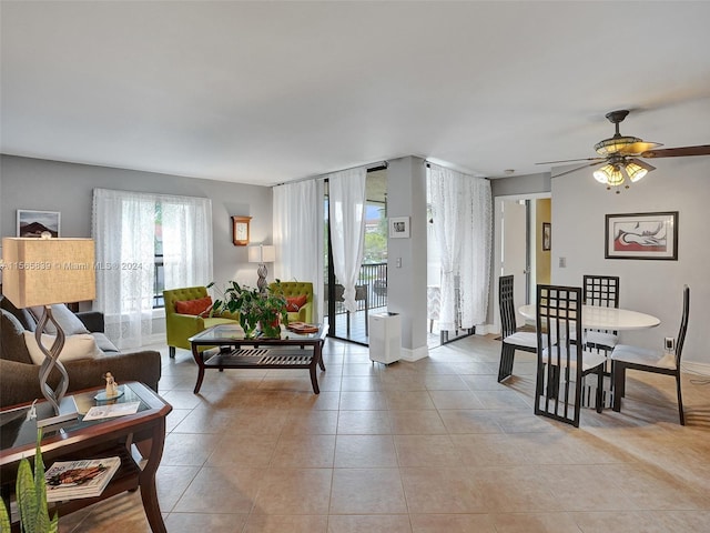 living room featuring ceiling fan and light tile patterned floors