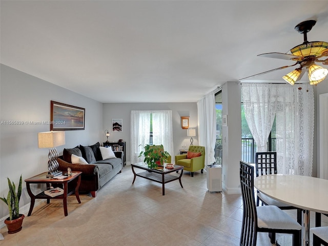 tiled living room with ceiling fan