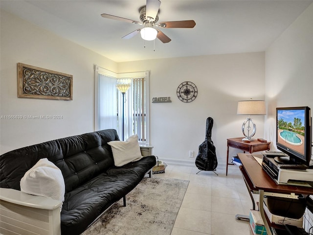 living room with ceiling fan and light tile patterned floors