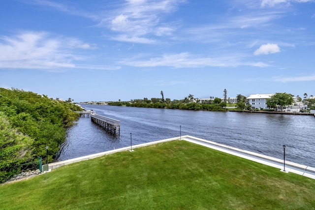 view of dock featuring a water view and a lawn