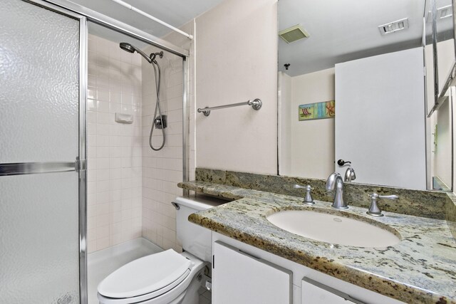 washroom with water heater, stacked washer and clothes dryer, a textured ceiling, and light tile patterned flooring