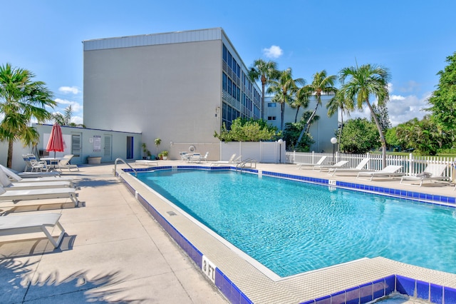 view of swimming pool with a patio