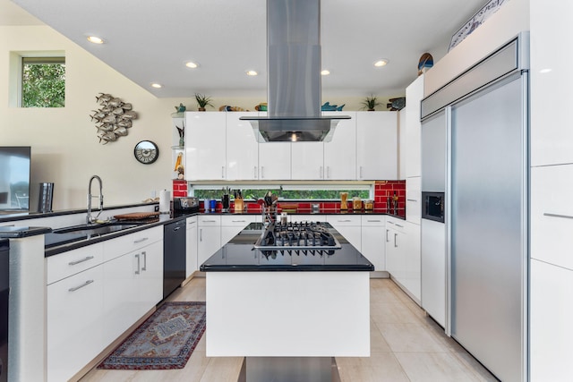 kitchen with white cabinetry, appliances with stainless steel finishes, and a kitchen island