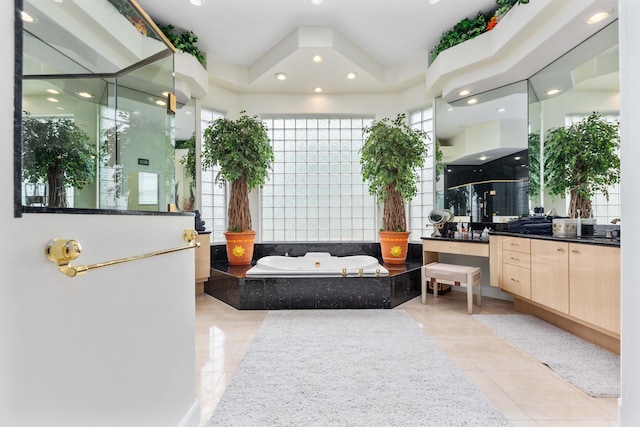 bathroom featuring vanity, shower with separate bathtub, and tile patterned floors