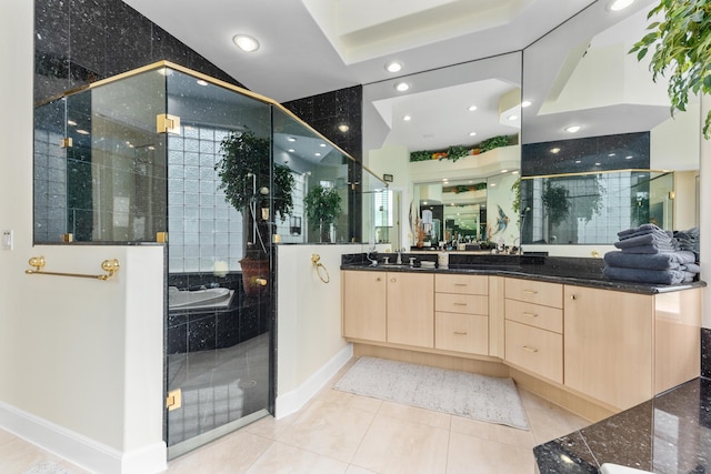 bathroom featuring vanity, tile patterned floors, and shower with separate bathtub