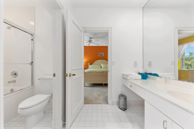 full bathroom featuring combined bath / shower with glass door, toilet, ceiling fan, vanity, and tile patterned flooring