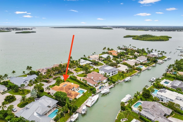 birds eye view of property with a water view