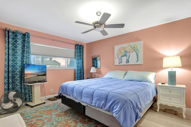 bedroom with ceiling fan and light hardwood / wood-style flooring