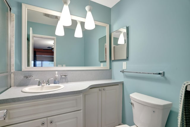 bathroom featuring vanity and toilet